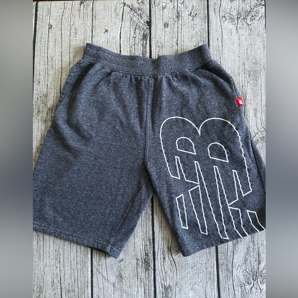 Like new. New Balance shorts Youth XL (18-20). Side pockets. Gray color